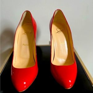 Red Christian Louboutin high heels.